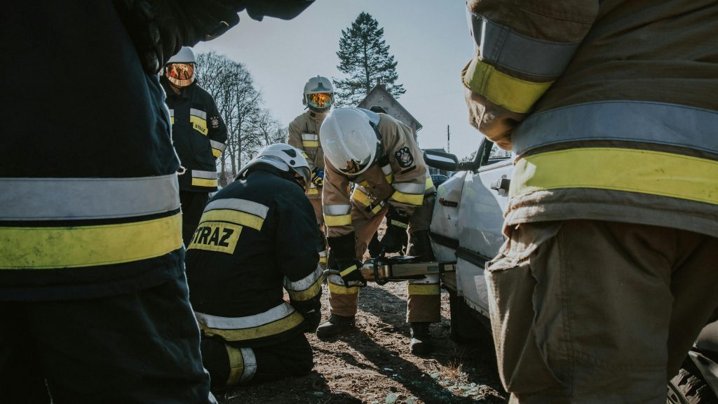 Firefighters in action using hydraulic tools during a rescue operation in Ocypel, Poland.